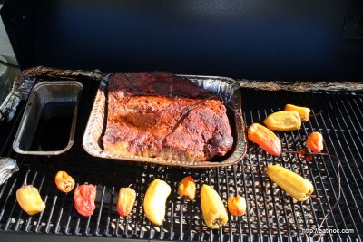 Pan of Dr. Pepper, Smoked Brisket, and Peppers