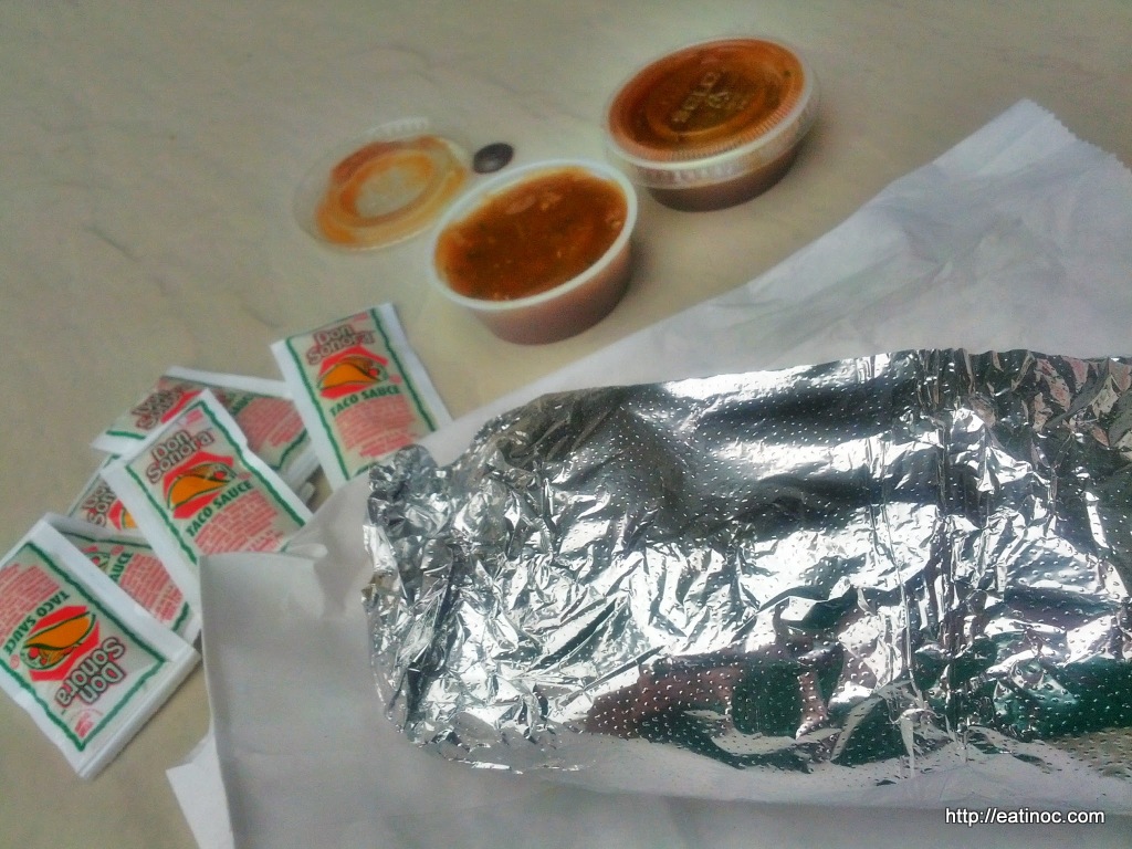 A Wrapped El Taco Breakfast Burrito with Sauce